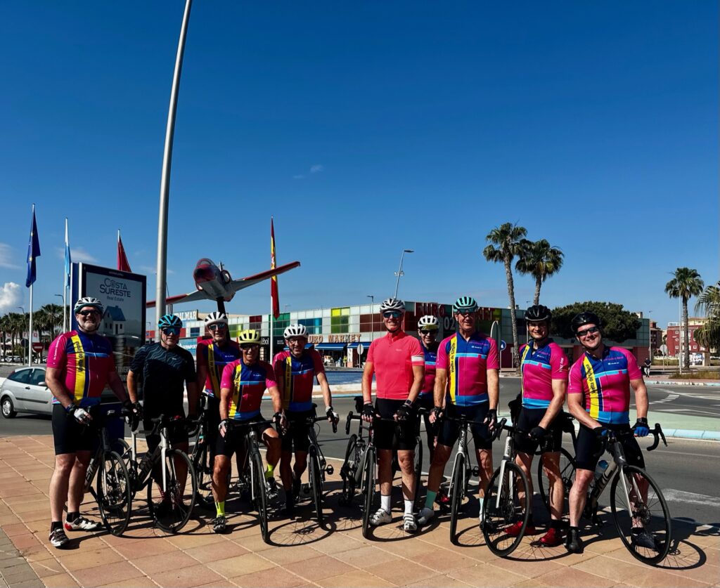 Group of cyclists with carbon road bikes on the Orihuela Costa, supported by OriMar Bikes